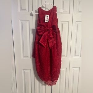 Beautiful high low children’s formal dress 
Never worn, size 12
